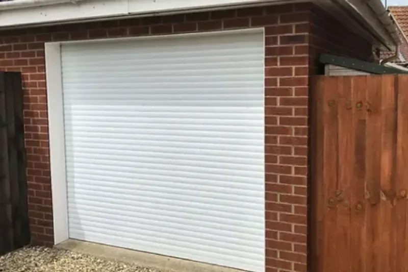 Anthracite grey roller garage door installed across a double opening