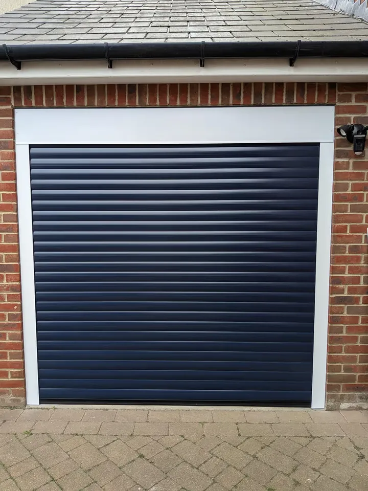 Dark blue 77mm roller garage door fitted to a single garage