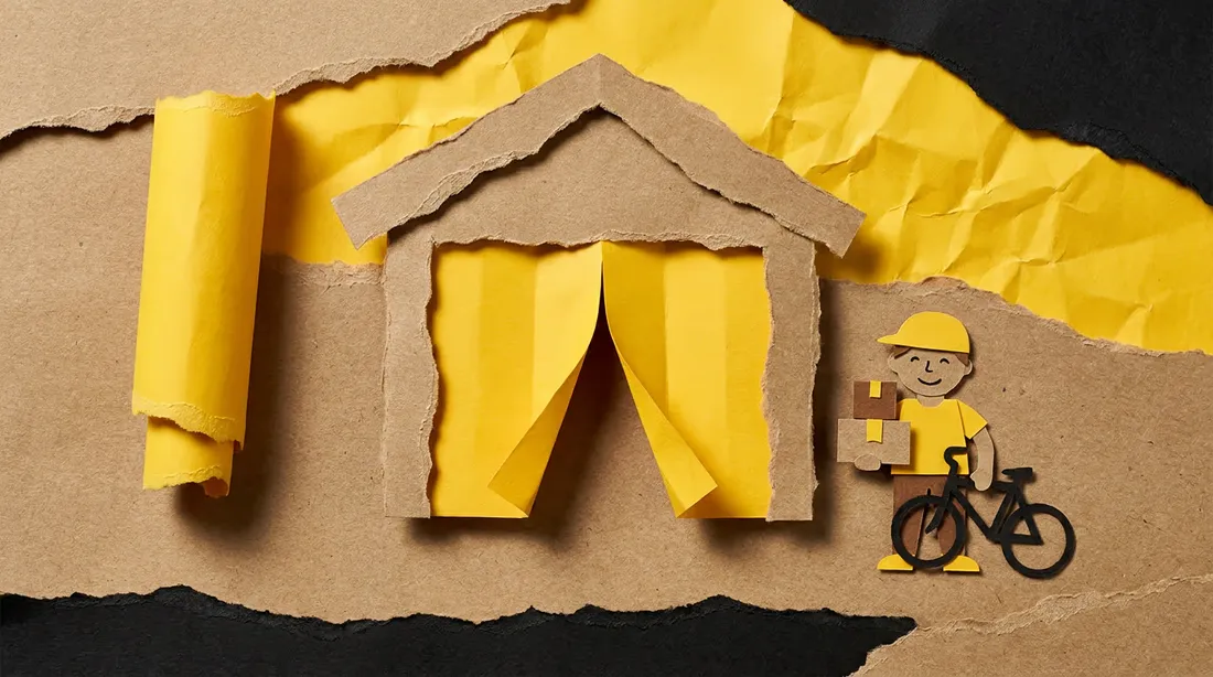 Cut paper collage of a paper figure clearing a garage ready for a new roller door