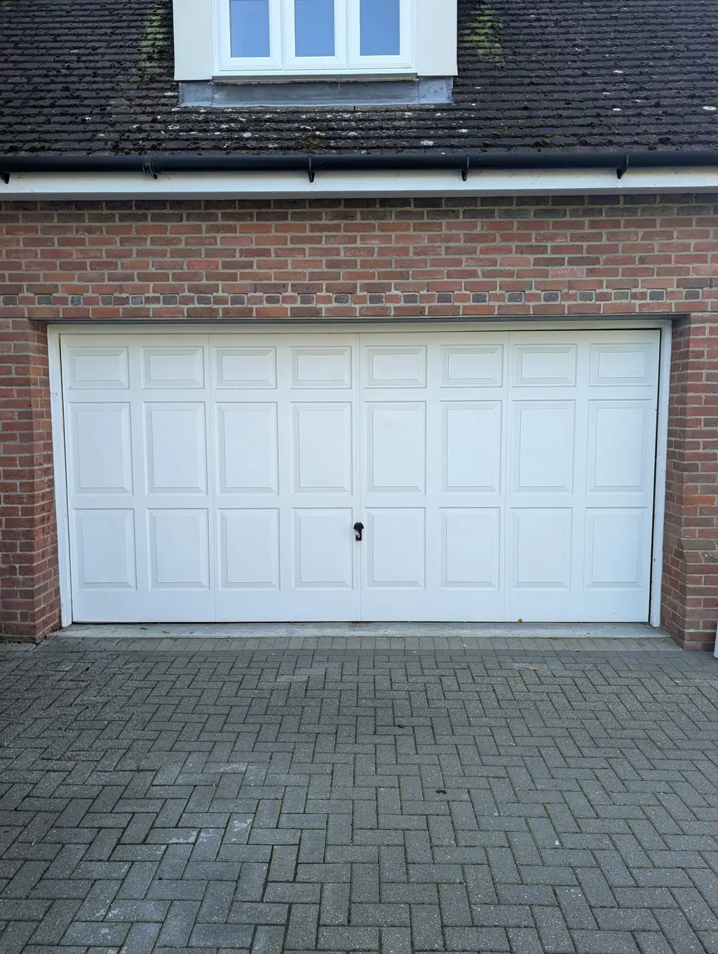 Before: original garage door at an Essex home prior to Rollrite installation